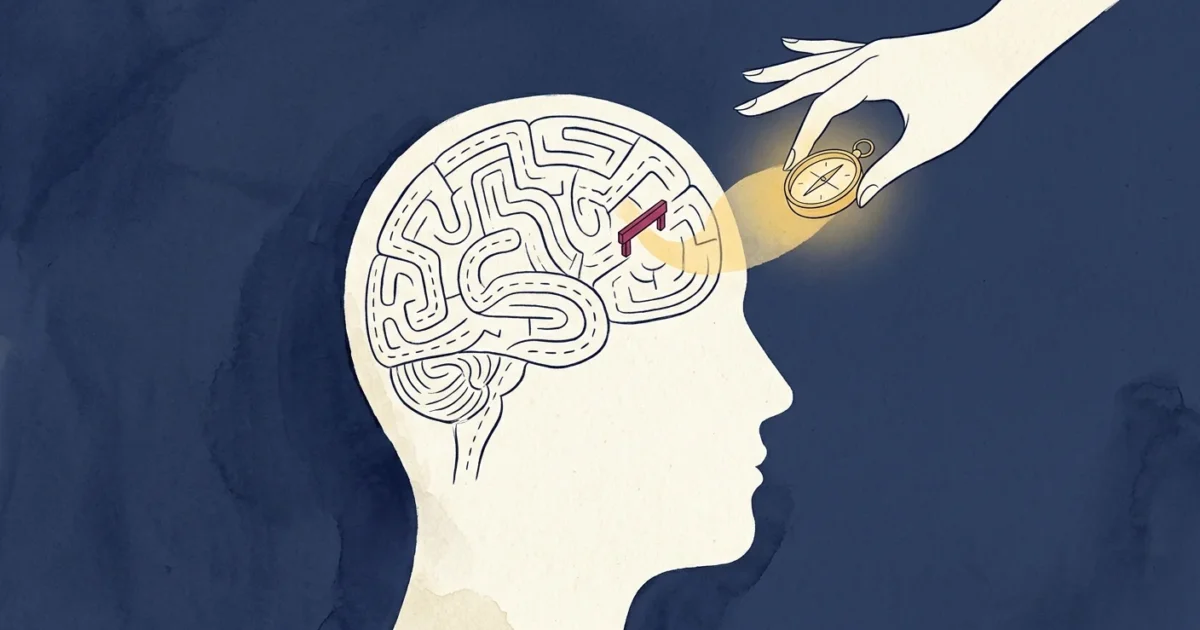 A conceptual illustration of a head profile containing a map with a small barrier and a hand holding a golden compass guiding the way.